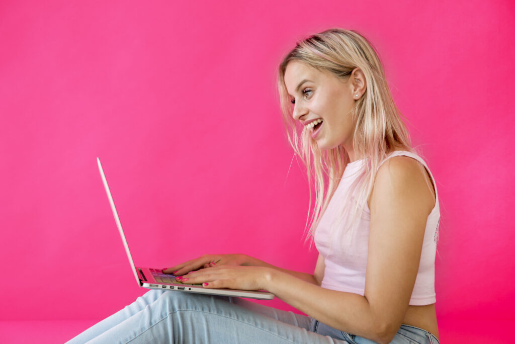 Blonde influencer using laptop